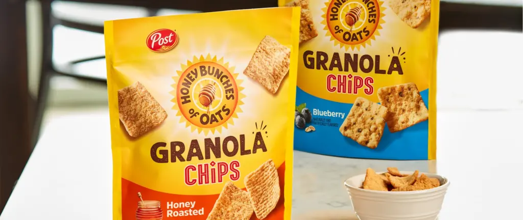 Two bags of Honey Bunches of Oats Granola chips with a bowl of chips nearby.