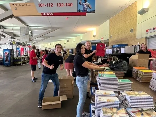 Two Post employees smile for a photo