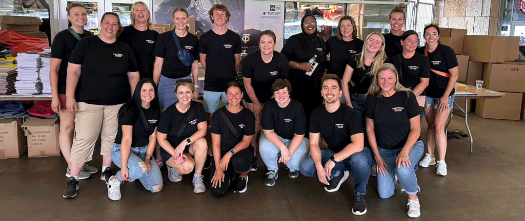 A group of Post employees pose for a photo.