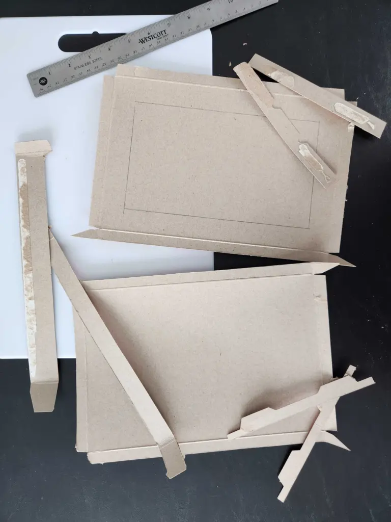 Different sized pieces of cardboard from the Honey Bunches of Oats with Strawberries box.