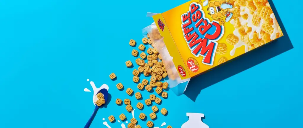 Waffle Crisps are poured into a paper bowl cutout with a paper milk glass cutout and spoon cutout