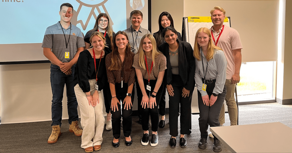 A group of interns pose for a photo.