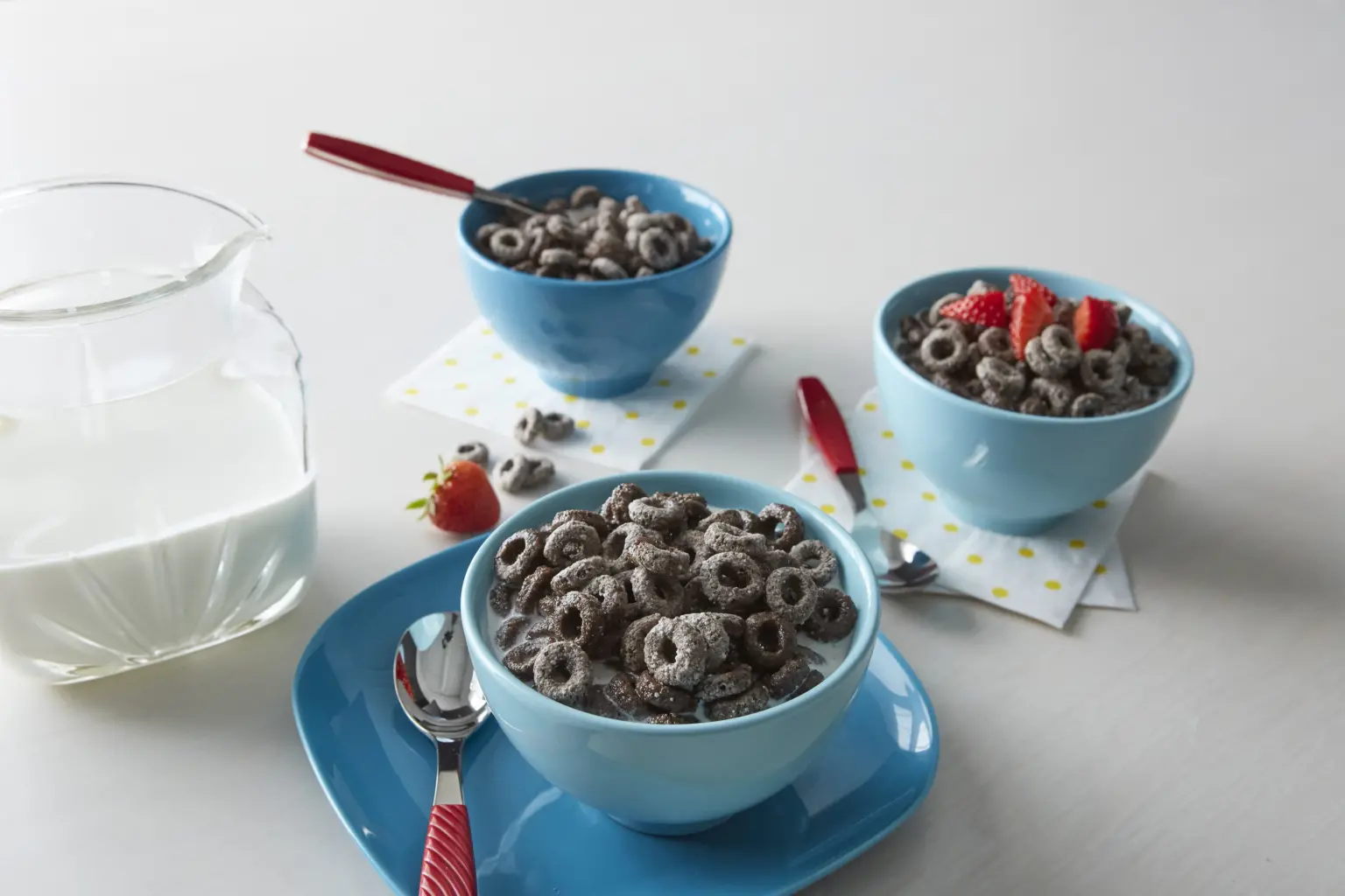 Three bowls of OREO O's cereal with milk