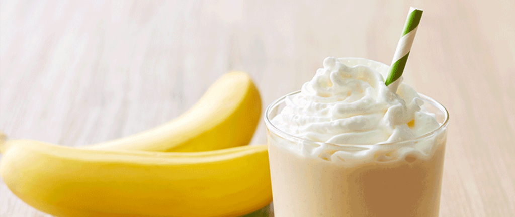 Bananas next to a smoothie