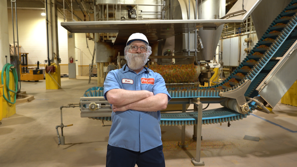 An employee stands in a warehouse