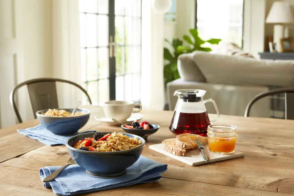 a breakfast spread featuring bowls of Grape-Nuts Flakes cereal