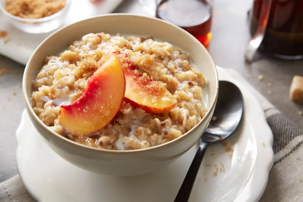 A bowl of Better Oats® topped with peach slices