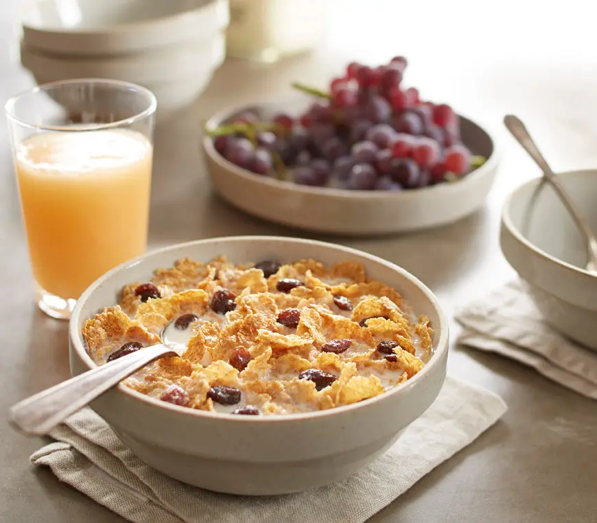 a bowl of Post Raisin Bran cereal with milk