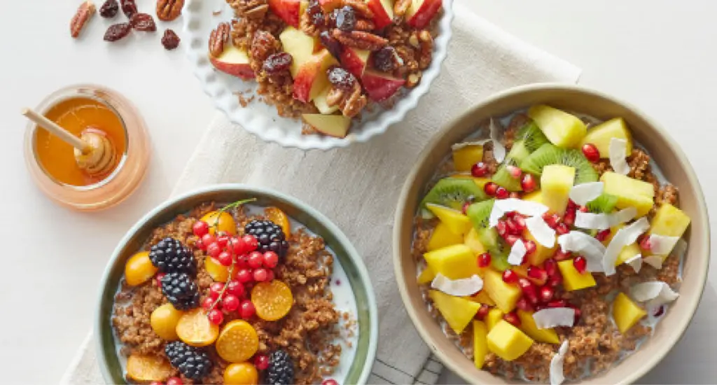 Bowls of cereal topped with fruit.