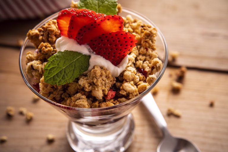 yogurt parfait with premier protein granola and strawberries