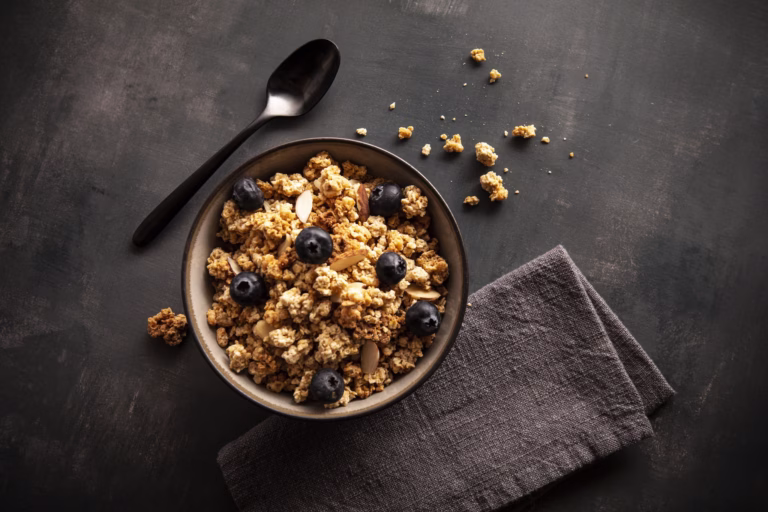 premier protein granola in bowl with blueberries