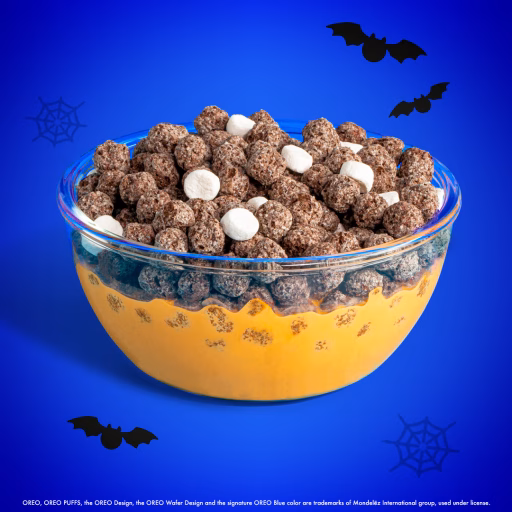 Halloween OREO PUFFS cereal in bowl with orange milk