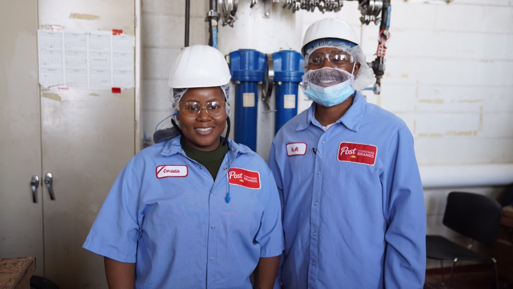 post consumer brands employees smiling for photo