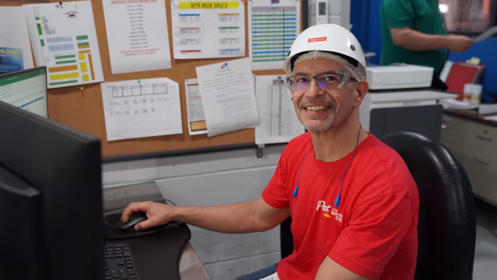manufacturing team member working at a computer
